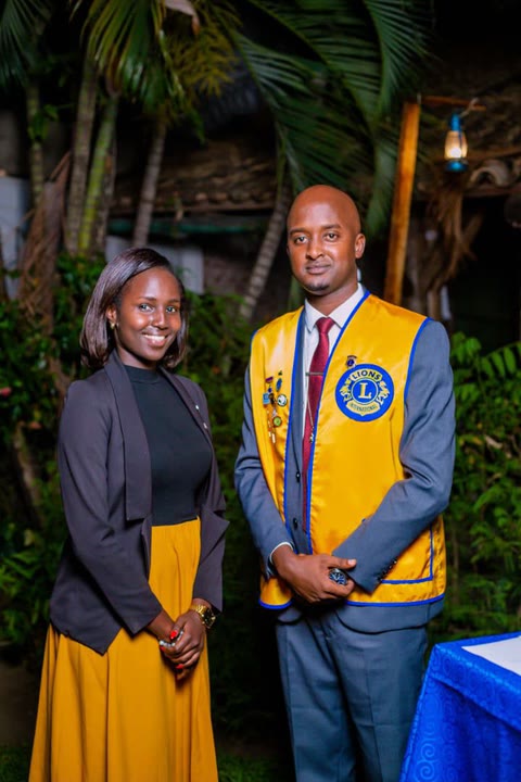 Nella beside a Lions Clubs International member in his Lions vest